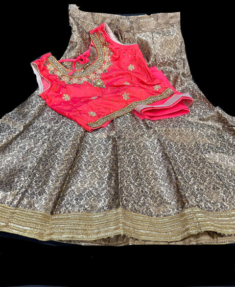 Neon Peachy Pink colour two toned silk based stone work blouse with golden brocade beautiful lehnga