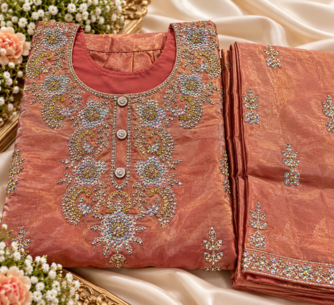 Peachy Rust Fendi silk kids’suit set with a loose palazzo, featuring intricate golden and rainbow-tone sequin & stone work that reflects a stunning multicolour shine.Elegant and perfect for special occasions.Slight variation in colour and design may occur
