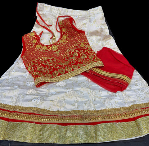 Velvet based heavy stone work blouse with golden cream colour silk lehnga with dupatta