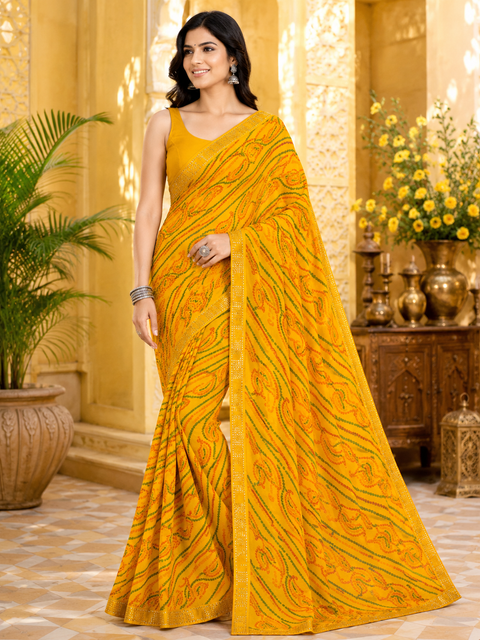 Soft georgette based bandhani print sarees with stones work border. Blouse Worn By The Model Is For Reference Purposes Only. The Blouse Piece Is Attached Separately With The Saree. Slight Variation In Color And Design May occur
