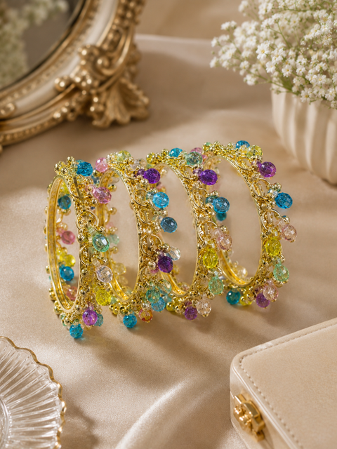Kashmiri style gold-tone bangles adorned with vibrant crystal charms.Pair these designer bangles with Kashmiri glass bangles to create classy look
(price per set ( 4 bangles in 1 set)(slight variation in color and design is possible)