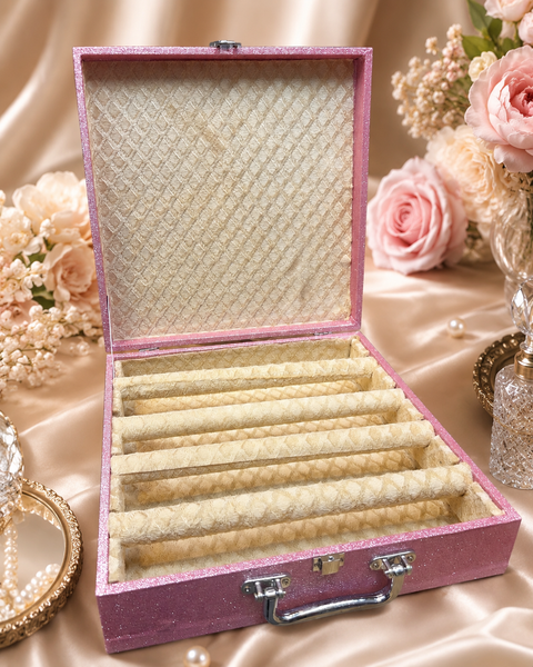Beautiful glittery pink bangle box with a soft cream patterned interior and multiple spacious bangle holders. Elegant, stylish and perfect for keeping your bangles organised, protected and beautifully displayed. Approx. Size: 32× 32× 9 Cm.