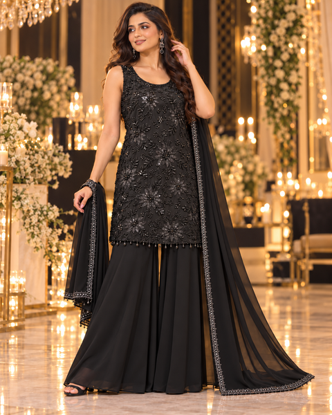 Elegant heavy handwork top paired with a loose circular palazzo and matching dupatta. A stylish festive outfit with beautiful detailed work, perfect for parties and special occasions.Slight variation in design is possible.