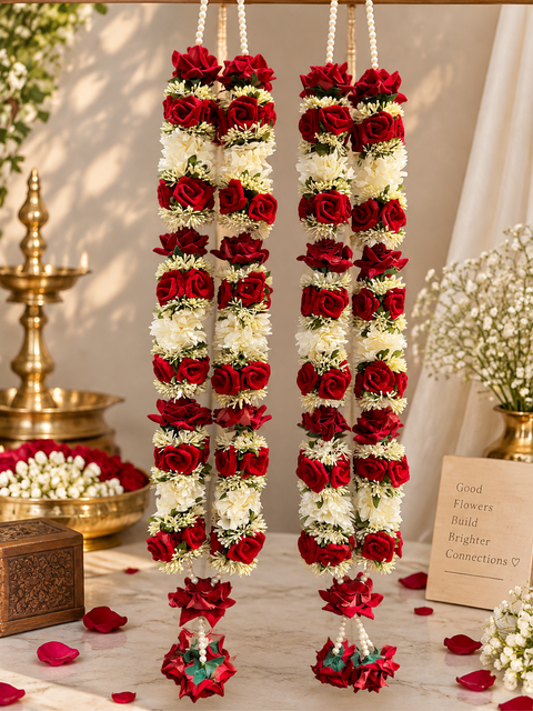 Beautifully Maroon crafted flowers and pearls Varmala / Jailmala , featuring elegant floral detailing and rich traditional accents. A perfect choice to add a vibrant and graceful touch to your special wedding ceremony.(comes in one pair)