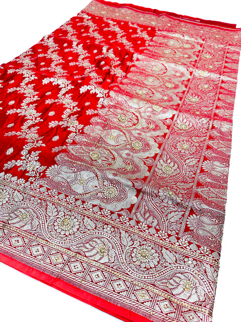 Beautifully designed Banarasi Silk Saree with heavy Handwork with stones & Zari