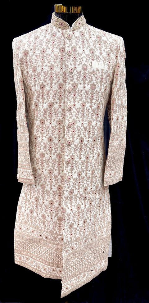 (Video clip attached )Cream Gold Beige color pink color  heavy embroidery work all over with hand work pearl beaded neck, buttons and sleeves design Sherwani and Pants