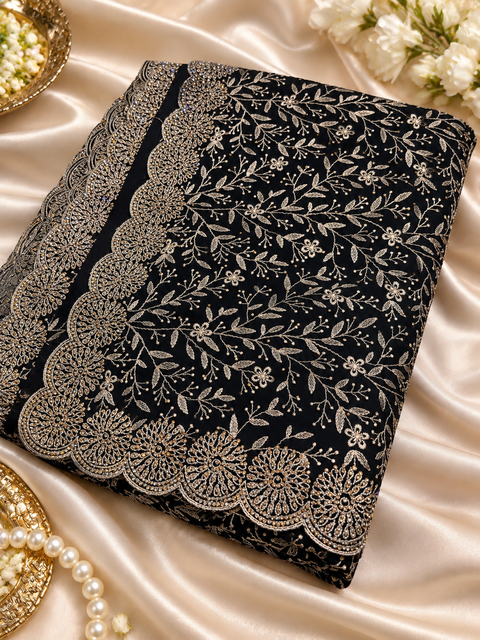 Black pure georgette saree with Kashmiri-inspired soft thread floral embroidery and delicate stone work all over. Finished with a beautifully detailed scalloped border for a rich, elegant look.