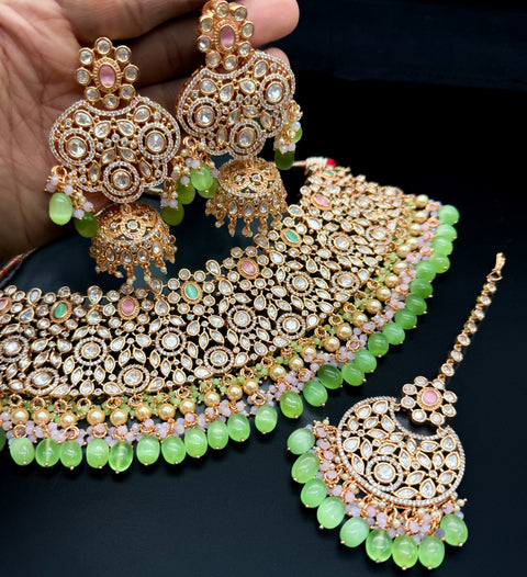 (video clip attached)Pastel Pink & Mint color Original American Diamond stones with Polki & pearls studded very Heavy work necklace with beautiful Jhumka, tikka NOTE:- original AD & Polki stones not fake plastic stones)
