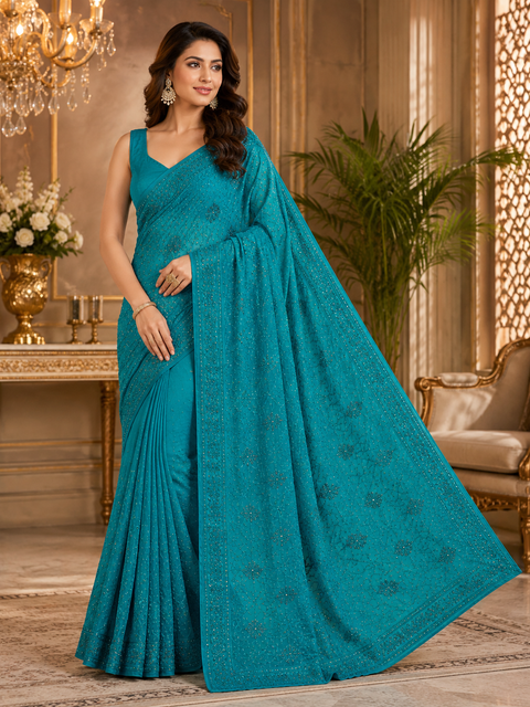 Beautiful Shimmery Georgette Saree featuring elegant embroidery and stone work throughout. Comes with an unstitched matching blouse piece. Model blouse is for reference purpose only. Slight colour and design variations may occur.