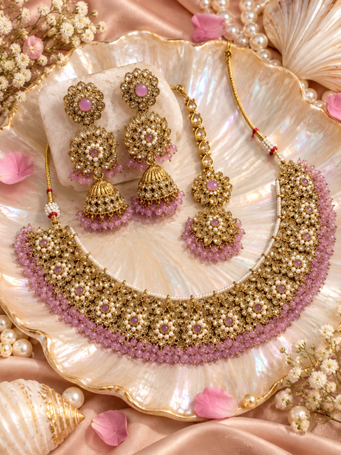 Beautifully crafted with sparkling golden stones, Polki-look stones, and colourful beads. Slight variations in colour and design are possible.
