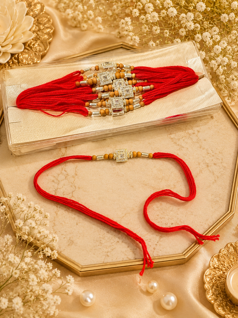 American Diamond Stylish stone designer Rakhi with pearl detailing.