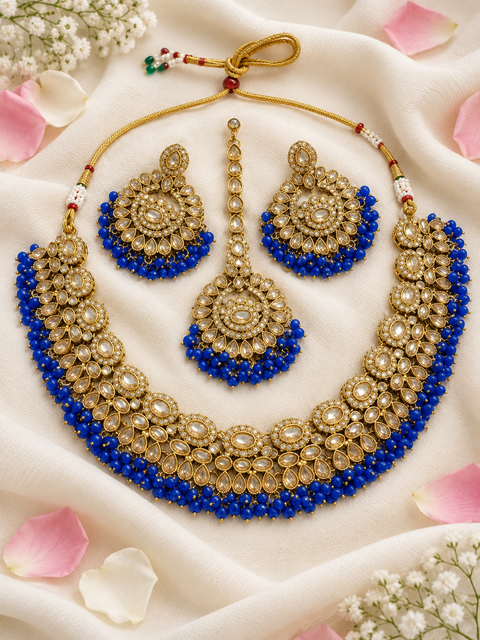 Beautifully crafted with sparkling golden stones, Polki-look stones, and colourful beads. Slight variations in colour and design are possible.