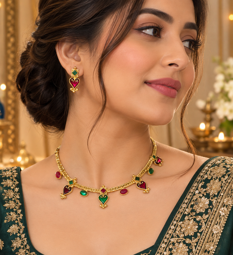 Elegant matte gold-finish green ,Ruby stone accents. Comes with matching earrings(slight variation in color & design may occur)