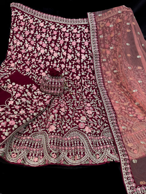 Maroon  colour Georgette based heavy embroidery work with stone work multiflared beautiful bridal lehnga with attached latkans And exact embroidery Potli Bag