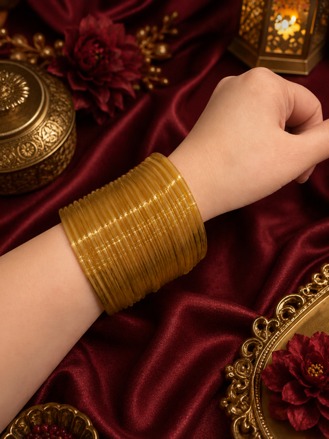 Golden color plain gloss glass bangles. Each set includes 2 dozen bangles. Price is per set. Slight colour variation may occur