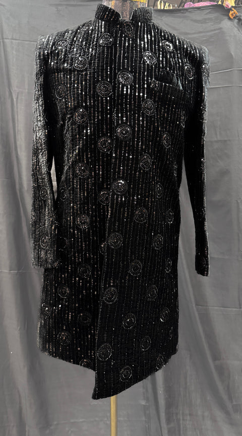(Video clip attached )Black color based black color heavy embroidery & sequined work all over with hand work pearl beaded neck, buttons and sleeves design Sherwani and black Pants