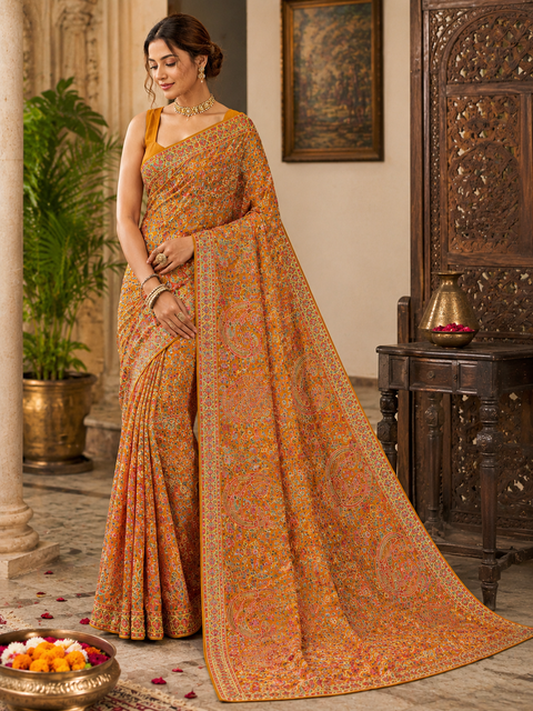 Rust Gold color Pure Georgette Chiffon Based Multicoloured Embroidery Work Jaal All Over With Stone Work Beautiful Saree.Comes with matching blouse piece. Model blouse is shown for reference purpose only. Slight variation in color and design may occur