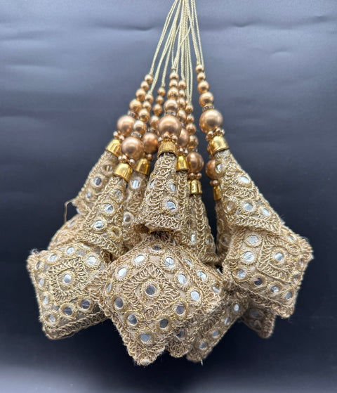 Beautiful lite golden design medium size lehnga latkans tessels (pair)