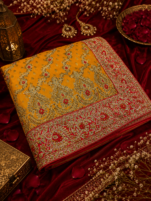 Beautiful Bridal Saree featuring intricate hand embroidery, rich gold zari work and sparkling stone embellishments. ✨Model blouse is for reference only. Blouse piece is attached with the saree. Slight variation in colour and design may occur.