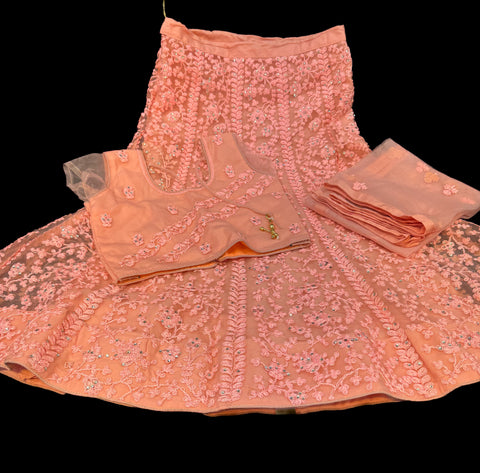 Peach colour netting based embroidery with stone work all over on lehnga & blouse with netting embroidered dupatta