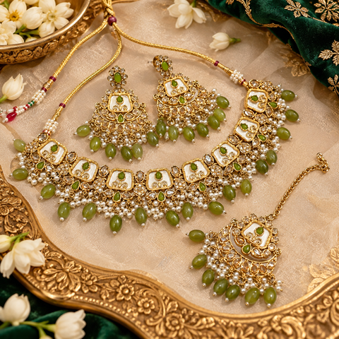 Beautiful polki stones with pearls and colorful stones necklace & earrings with Tikka. Slight variations in colour and design are possible
