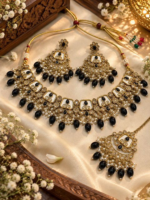 Beautiful polki stones with pearls and colorful stones necklace & earrings with Tikka. Slight variations in colour and design are possible