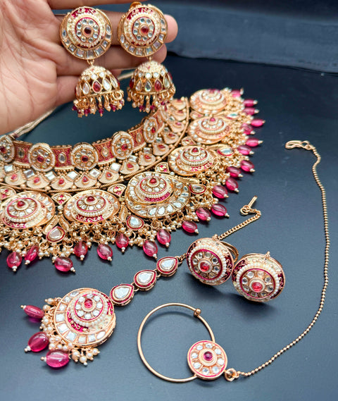 (video clip attached)Pastel Pink on Rosegold shade base Original Kundan Polki stones with Meenkari & Pearls work Bridal necklace with beautiful Jhumka, tikka , 2 Rings NOTE:- original Kundan Polki stones not fake plastic stones)
