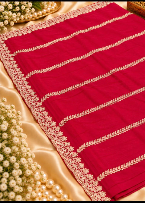 Georgette Saree with a soft, graceful fall,featuring elegant vine embroidery,delicate stonework and a beautifully detailed floral border. Attached blouse piece included; model blouse is for reference only. Slight variation in colour and design may occur
