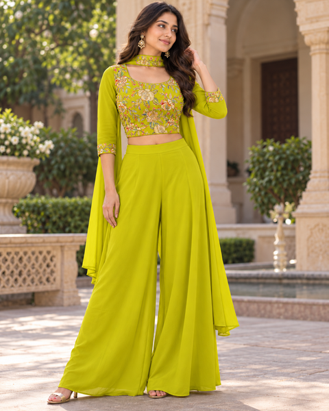 Elegant crepe Silk blouse featuring beautiful embroidery and sequin work, paired with a flowy georgette loose circular palazzo for a stylish Indo Western look. Slight variation in colour and design is possible.