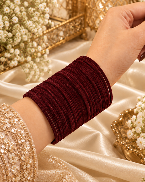 Elegant velvet bangles in a rich Dark Maroon shade, perfect for festive, bridal and traditional looks. Each pack includes 3 dozen bangles (36 pieces). Price is per pack. Slight variation in colour may be possible