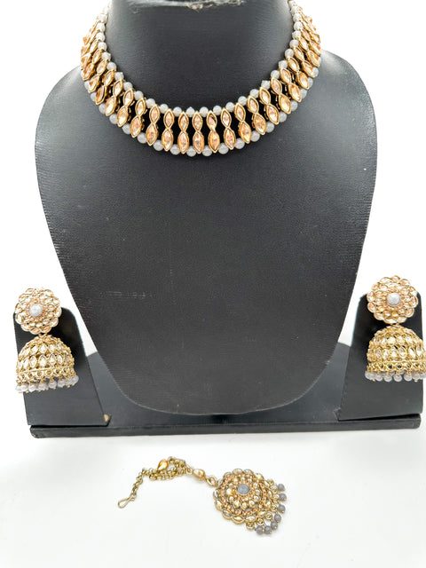 Golden stone with pearls studded simple Necklace with beautiful Jhumka & Tikka set