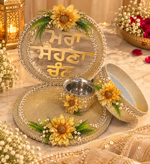 Beautiful Karwa Chauth Thali Set in a classy gold theme with floral detailing, pearl work and a decorative Punjabi stand, along with matching thali, channi and kalash. Slight variation in colour and design is possible.