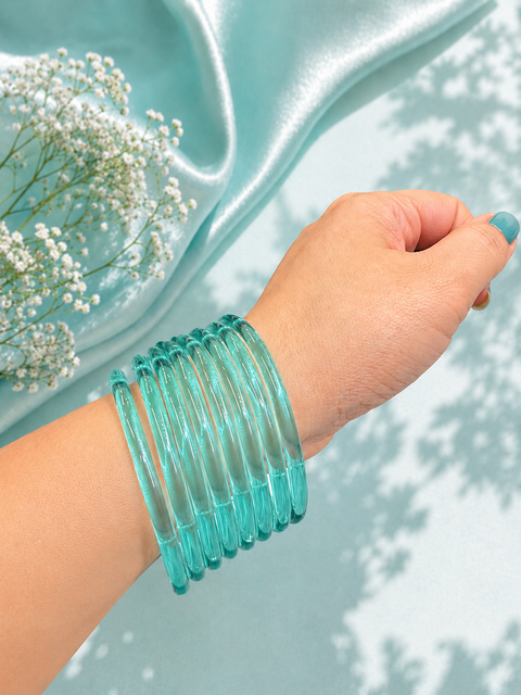 Aqua color Ultra-trendy jelly bangles with glossy vibrant shades — the perfect statement stack to elevate your everyday and festive looks (slight variation in color and design is possible) Eight bangles per set (price per set)