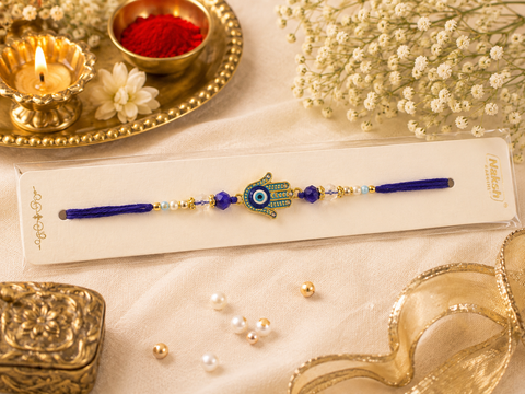 Evil eye Elegant handcrafted Rakhi with premium beads and sparkling stonework, beautifully crafted to celebrate the special bond of love and protection.