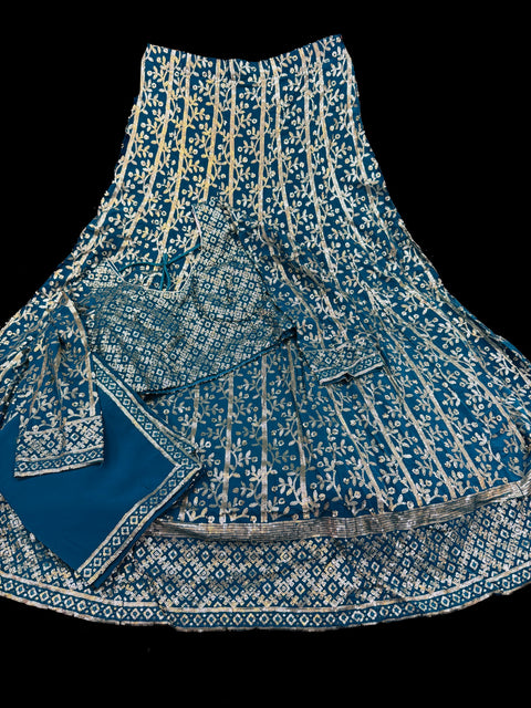 All over embroidery with sequined work heavy design crop top blouse with heavy work multiflared lehnga and netting dupatta