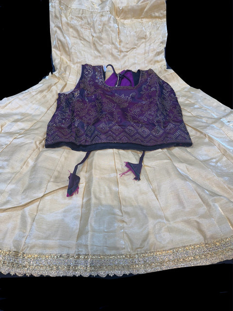 Wine colour stone work blouse with golden colour raw silk based lehnga