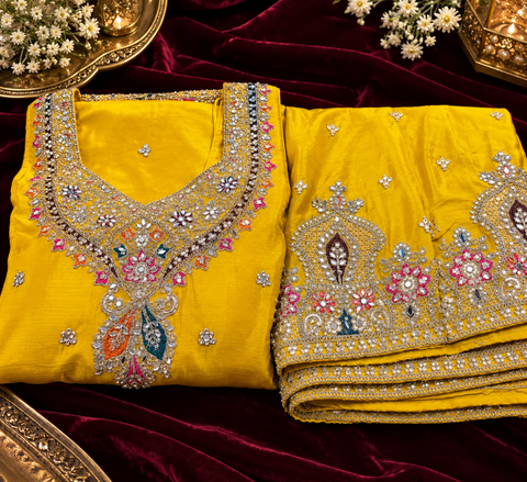 Beautiful georgette fabric outfit with full embroidery and mirror work all over the kameez. Paired with a loose circular palazzo and a matching dupatta with just a border. 
Slight variation in colour and design is possible