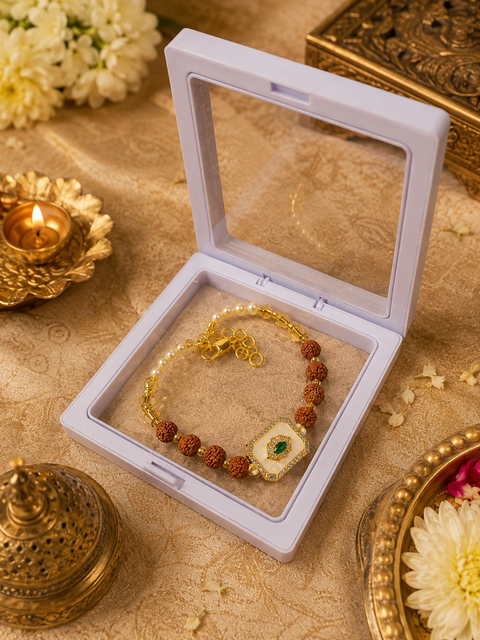 Premium Rudraksha bracelet-style Rakhi with elegant crystal and pearl detailing, beautifully packed in a luxury gift box for your beloved brother