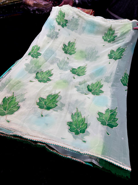 Beautiful handwork design on contrast leaf border on soft Georgette Saree with contrast blouse