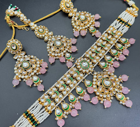 Beautiful Kundan and pearls work classy choker set with beautiful earrings & Tikka