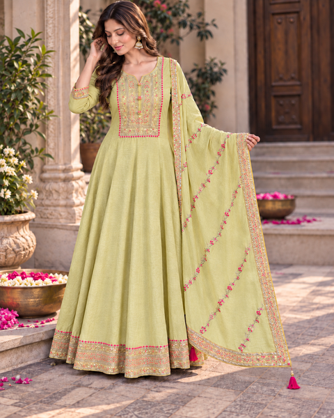 Soft Lime Yellow color Elegant flared Anarkali featuring delicate multicolour embroidery on the neckline, sleeves and hem, paired with a matching embroidered dupatta. Slight variation in colour and design is possible.