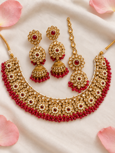 Beautifully crafted with sparkling golden stones, Polki-look stones, and colourful beads. Slight variations in colour and design are possible.