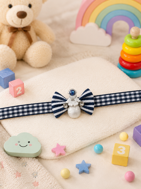 Adorable kids’ Rakhi featuring a cute bow design with sparkling details and a stylish checkered band. Perfect for making little ones’ Raksha Bandhan extra special.