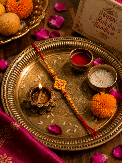 Elegant handcrafted Rakhi with premium beads and sparkling stonework, beautifully crafted to celebrate the special bond of love and protection.