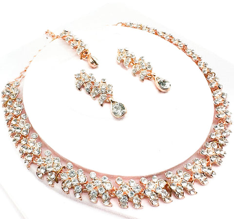 Rose gold color Jerkan stone studded beautiful necklace set with Earrings & Tikka