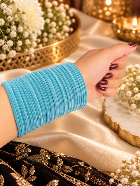 Elegant velvet bangles in a rich Aqua  Blue shade, perfect for festive, bridal and traditional looks. Each pack includes 3 dozen bangles (36 pieces). Price is per pack. Slight variation in colour may be possible