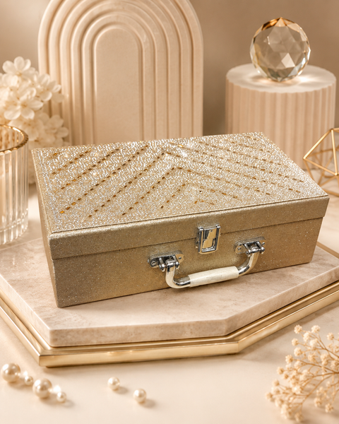 Beautiful champagne-gold bangle box with a sparkling finish, elegant patterned interior, and two spacious bangle holders. A stylish and practical way to store and organise your bangles safely.