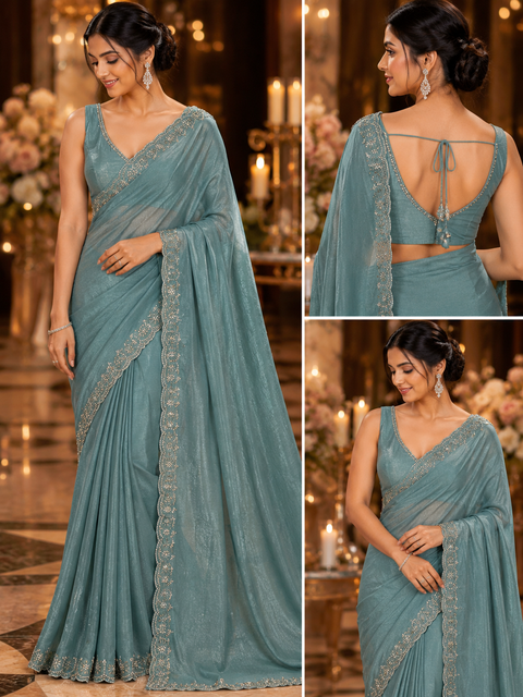 Shimmery Jimmy Choo Style Saree with a delicate handwork border and graceful flowy drape. Comes with a matching blouse piece; the blouse worn by the model is for reference purposes only. Slight variation in color and design may occur.