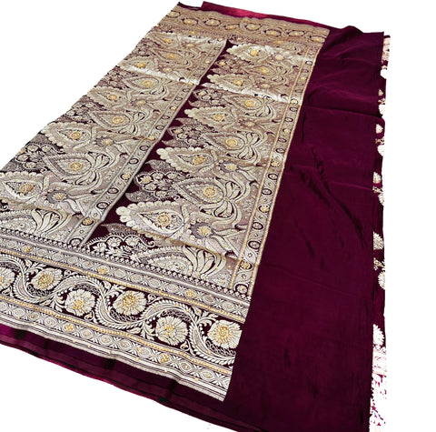 Beautifully designed Banarasi Silk Saree with heavy Handwork with stones & Zari