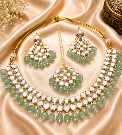 Elegant mirror necklace set adorned with beads and pearl detailing, perfect for adding a royal touch to your traditional look
 ( slight variation in color and design is possible )